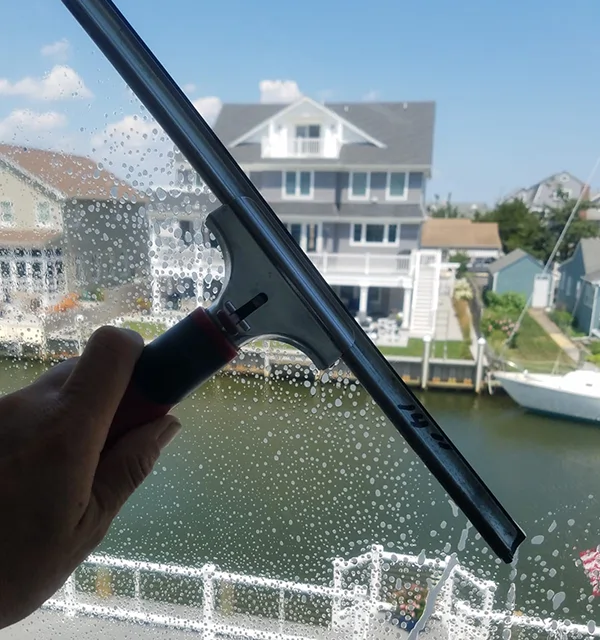 NJ Window Cleaning With A Squeegee